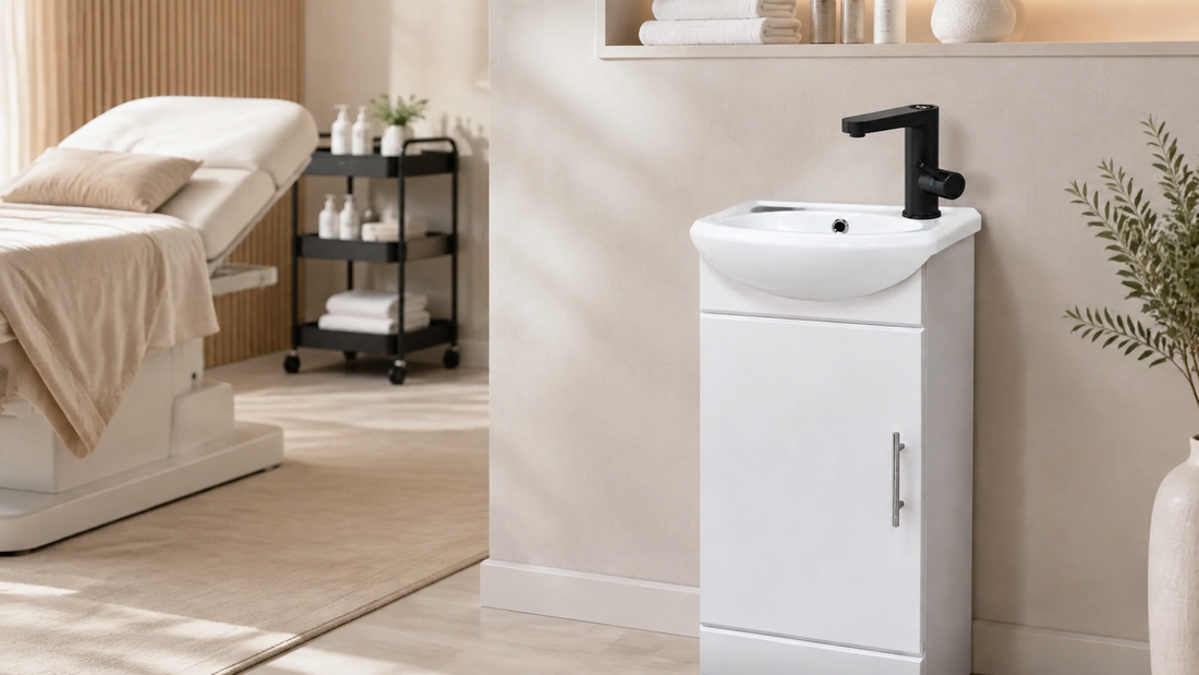 FlexiRinse white portable no-plumbing sink with black electric tap in a modern beauty salon treatment room.